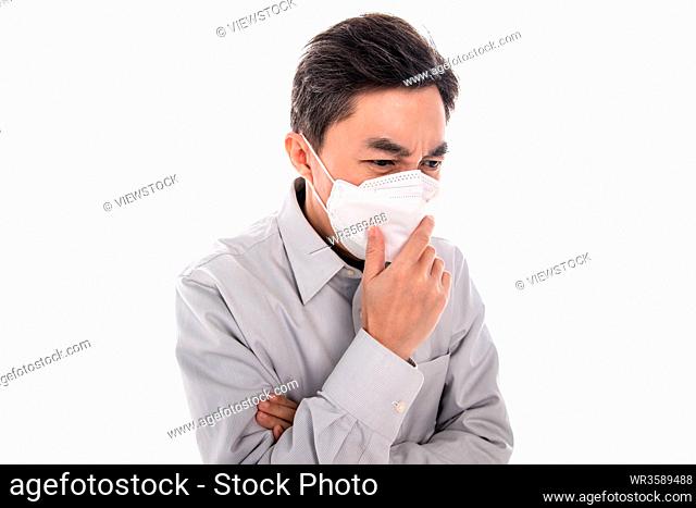 Sick middle-aged man wearing a mask