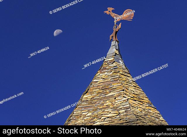 Moon and the roof of the bell tower of the church of Sant Roc, in Farrera, in the Coma de Burg valley, on a summer morning (Pallars SobirÃ , Lleida, Catalonia