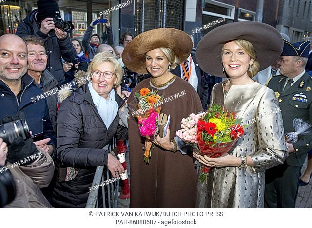 Queen Mathilde of Belgium and Queen Maxima of The Netherlands with well wishers during their visit to the Flemish culture house de Brakke Grond in Amsterdam