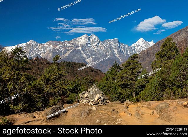 View down the valley from Deboche. A part of the Tengboche Monastery is seen on the left-hand side, on the ridge. Sheer slope of Kongde close the view with the...