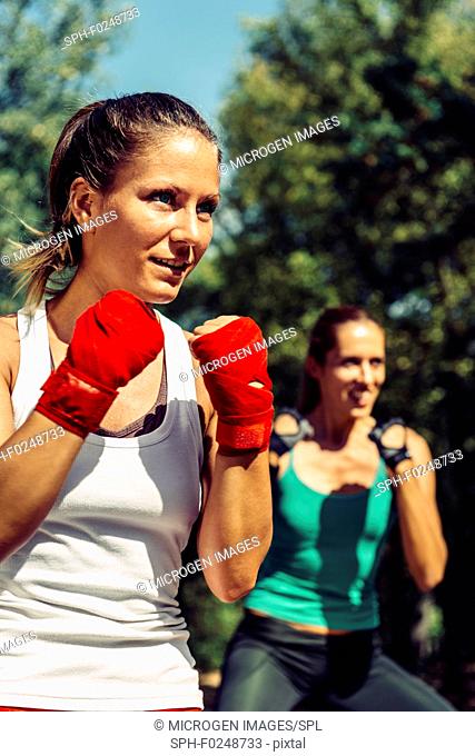 Young women in Tae Bo exercise class