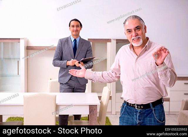 The male real estate agent and male client in the apartment