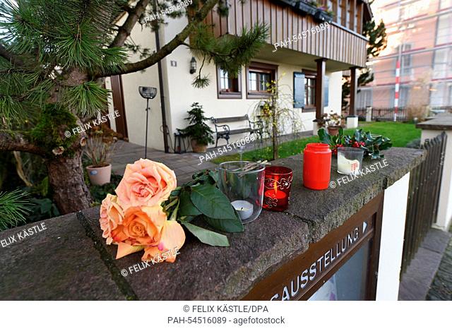 Flowers and burning candles lie and stand in front of the house of the late singer and composer Udo Juergens in Gottlieben, Switzerland, 22 December 2014