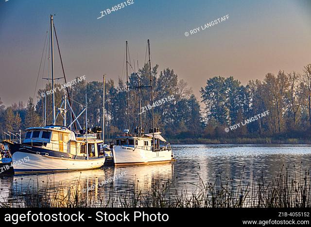 Pleasure craft with a background of dense forest fire smoke in Steveston British Columbia Canada