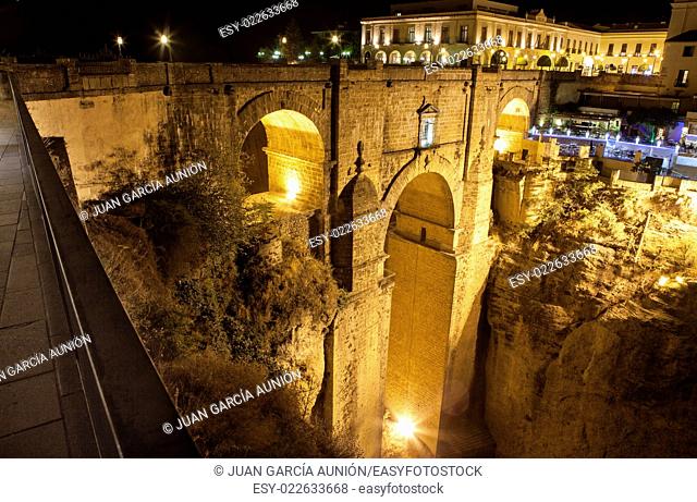 Illuminated bridge from old town of Ronda, Spain. Night scene