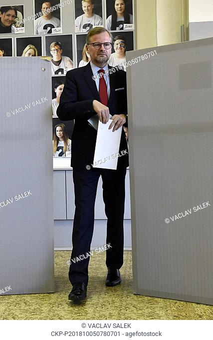 Civic Democrat (ODS) head Petr Fiala casts their ballots at a polling station during the First day of local elections in Brno, Czech Republic, October 5, 2018