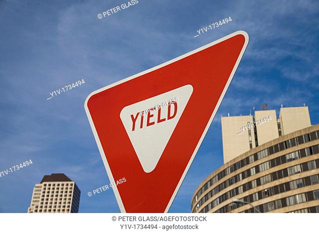 'Yield' traffic sign in front of a building
