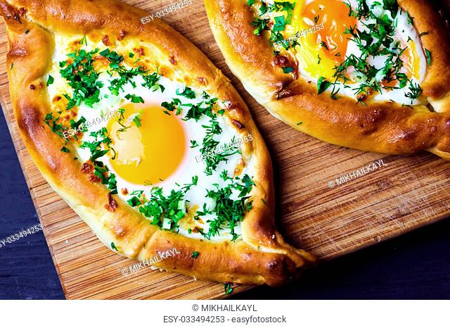 Beautiful open pies with egg and onions on wooden background