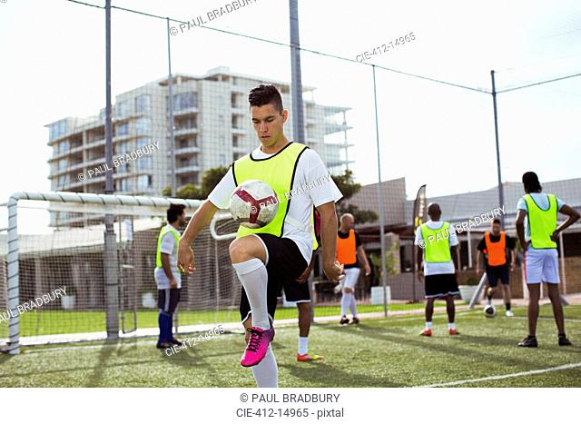 Soccer player training on field