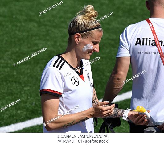 Germany's Anja Mittag with suncream during a training session at the FIFA Women's World Cup 2015 at the Avenue Bois-de-Boulogne, Laval in Montreal, Canada