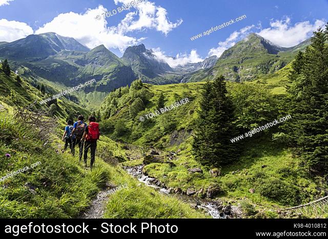 hikers on the trail, Ascending towards Hourgade Peak, L'Ourtiga, Luchon, Pyrenean mountain range, France