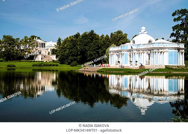 Russia, Saint Petersburg, Pushkin. Cameron Gallery and Grotto Pavilion reflected in the Great Pond at Catherine Park