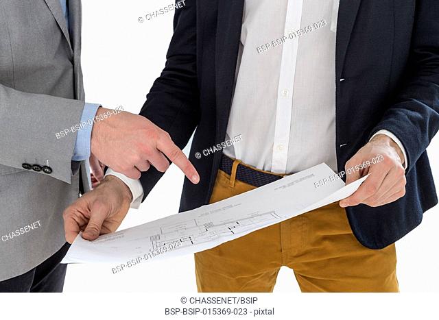 Real-estate agent showing house plans to a businessman.on white backgound