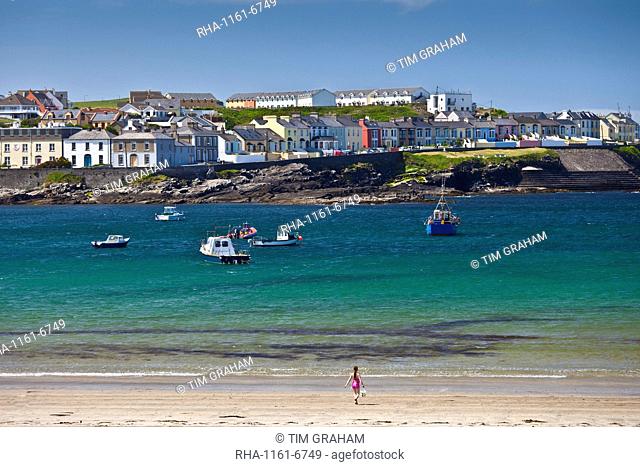 Ocean front houses and child playing on sandy beach at Kilkee County Clare, West Coast of Ireland