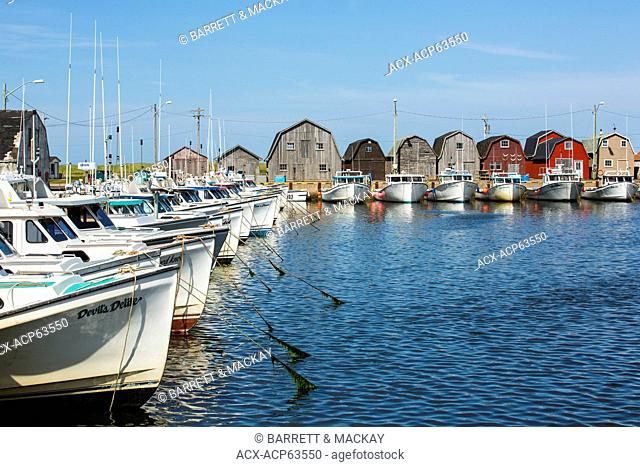 Fishing boats tied up at Malpeque Harbour wharf, Prince Edward Island, Canada