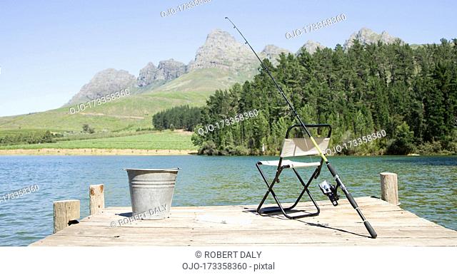 Fishing pole and chair on dock