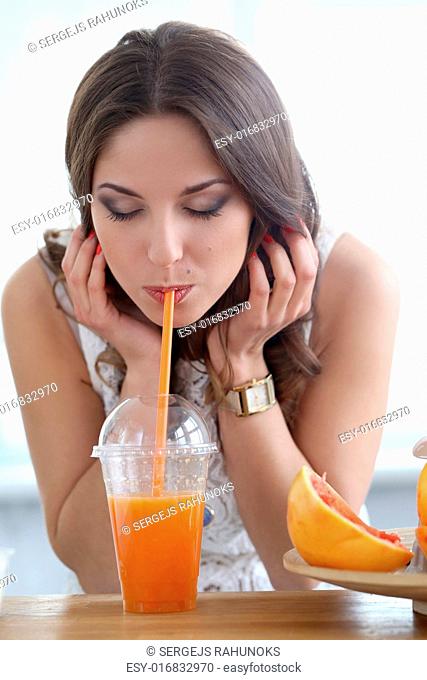 Cute, attractive woman with orange juice