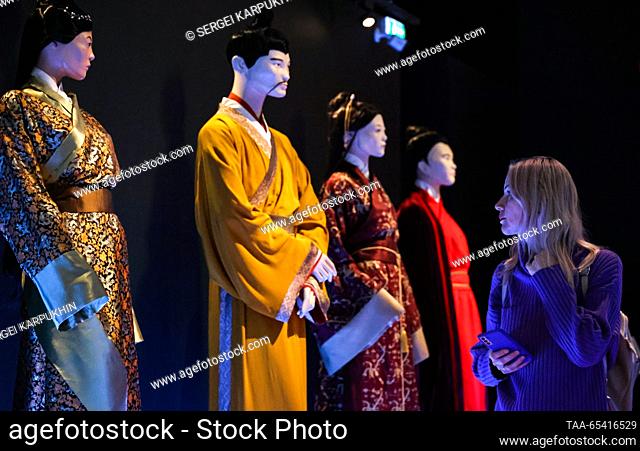 RUSSIA, MOSCOW - DECEMBER 2, 2023: A woman attends an exhibition titled ""The Terracotta Army: The Immortal Warriors of China"" at Pavilion 22 at the VDNKh...