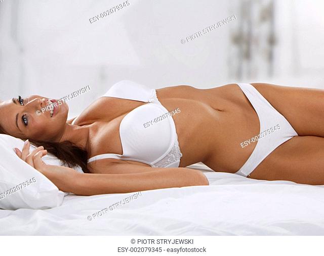 young beautiful woman on bed