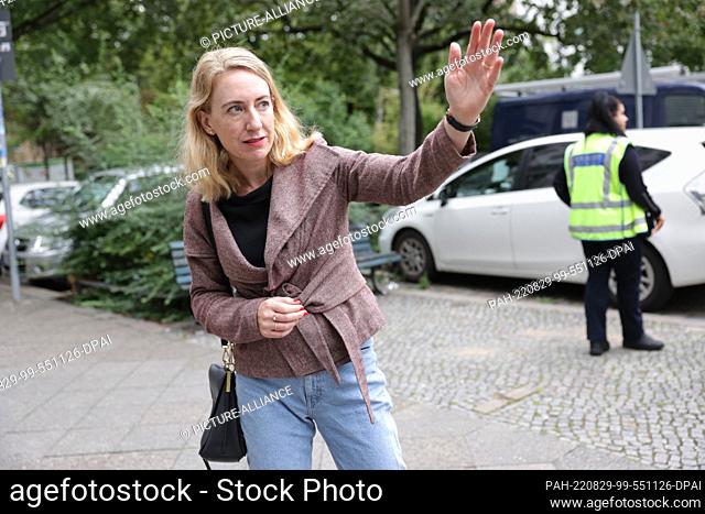 29 August 2022, Berlin: Almut Neumann (Bündnis90/Die Grünen), district councilor in Berlin-Mittte, gesticulating in front of a vehicle that is about to be towed...