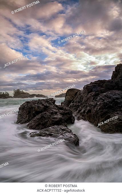 Water flows around the rocks of South Beach as high tide approaches, Pacific Rim National Park, British Columbia, Canada
