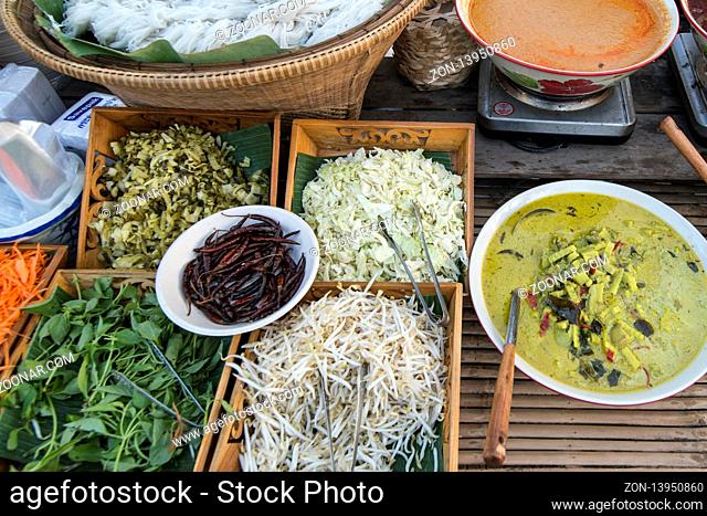 thai curry and Thai food at the market street at the Loy Krathong festival at the Historical Park in Sukhothai in the Provinz Sukhothai in Thailand