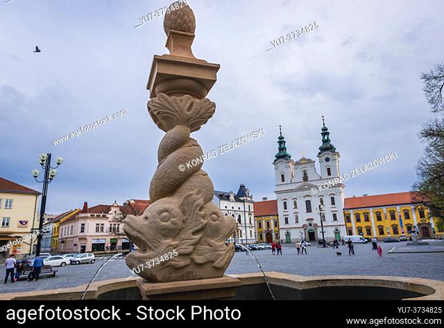 Fountain and Church of Saint Francis Xavier on the Masaryk Square in Uherske Hradiste city in Zlin Region, Moravia in Czech Republic