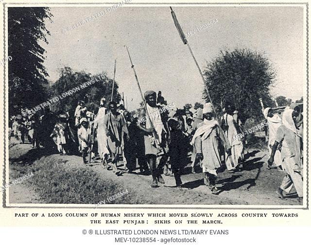 Part of a long column of refugee Sikhs marching across the East Punjab to escape the sectarian religious violence sparked by the partition of India