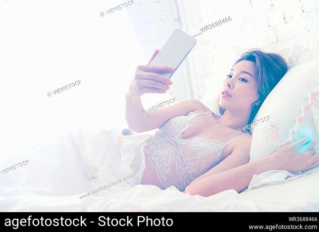 Lying in bed take beautiful young women