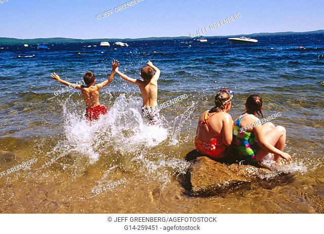 Kids splashing. Sebado Lake Family Campground. Maine. USA