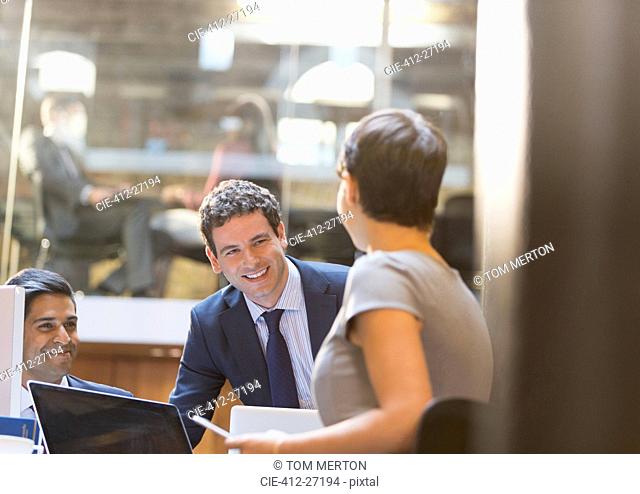 Smiling business people working in office