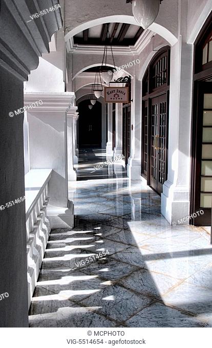 Singapore shadows in hallways of world famous Raffles Hotel 1887 exclusive resort - 16/11/2015