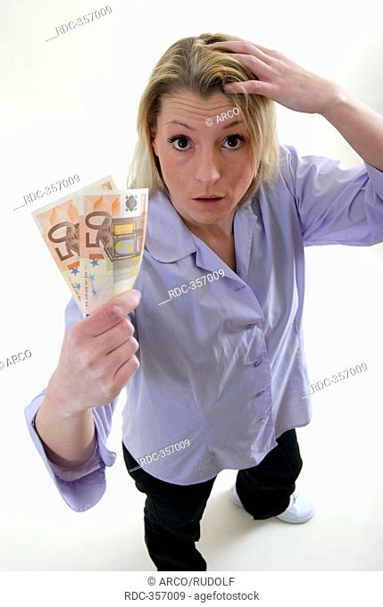 Young woman with money in her hand