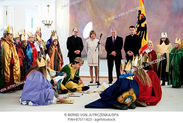 German Federal President Joachim Gauck (2-R) and his partner Daniela Schadt (2-L) receive young carol singers from the diocese Fulda with prelate Klaus Kraemer...