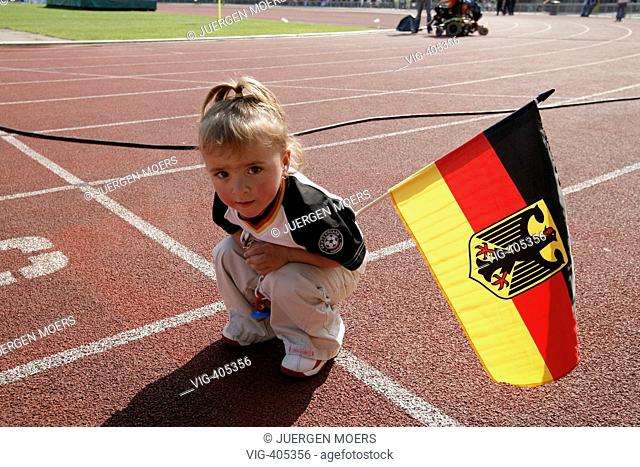 12.09.2006, Germany, North Rhine-Westphalia, Dortmund: little girl with Germany flag in the stadium, 4. INAS FID football WM 2006 of the handicapped ones