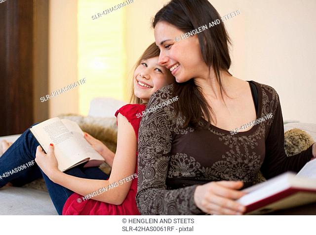 Mother and daughter reading separately