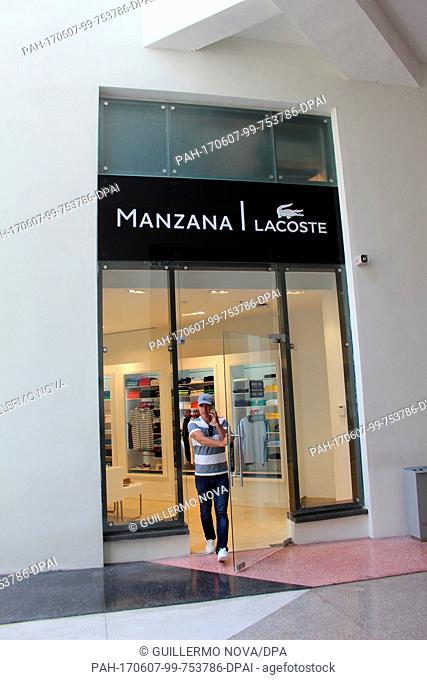 A man leaves a Lacoste-store at the shopping gallery of the Gran Hotel Manzana in Havana, Cuba, 24 May 2017. Selected luxury brands can be found at the hotel's...