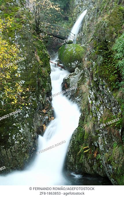 Waterfall with bridge at Estrela Mountain Natural Park, Portugal