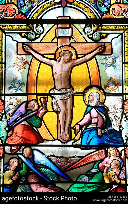 Jesus Christ on the cross. Stained glass window. Our Lady of La Salette. La Salette-Fallavaux. Isere. Auvergne Rhône-Alpes. France. Europe