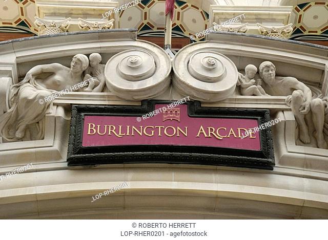 England, London, Westminster, Elaborate ornate stonework and sign above the entrance to Burlington Arcade in Piccadilly