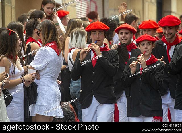 A woman turns her back as a sign of protest against the participation of women as members the traditional 'Alarde de San Marcial' parade through the streets