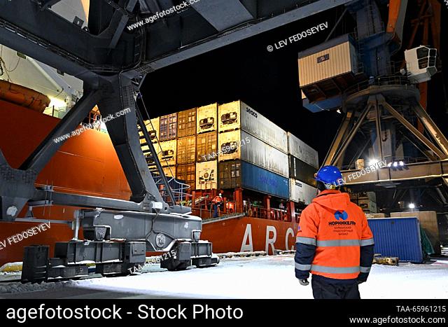 RUSSIA, MURMANSK - DECEMBER 20, 2023: Norilsk Nickel’s diesel-electric ship Talnakh unloads her 13, 000t cargo delivered to the port of Murmansk overnight into...