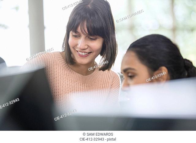 Female college students using computer