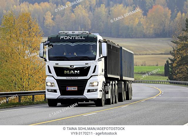 Salo, Finland - October 13, 2018: White MAN TGX 35. 580 truck of Fontell Granite Ltd in seasonal sugar beet haul along autumnal highway in Finland