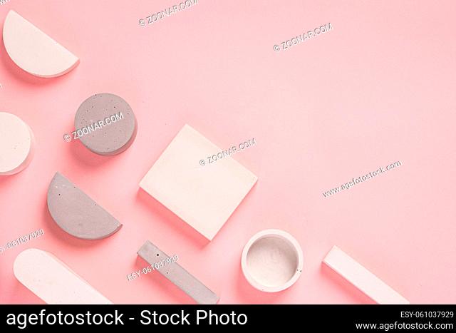 Top view of geometric shaped on pastel pink background. modern style. High quality photo