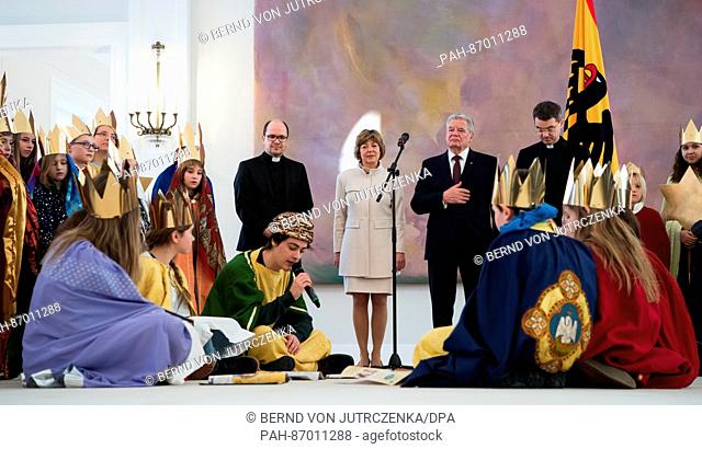 German Federal President Joachim Gauck (3-R) and his partner Daniela Schadt (M) receive young carol singers from the diocese Fulda with prelate Klaus Kraemer...