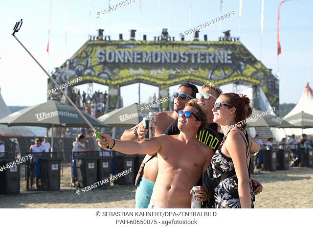 Festivalgoers take a selfie at the SonneMondSterne electro music festival in Saalburg-Ebersberg, Germany 8 August 2015. More than 100 artists and groups are due...