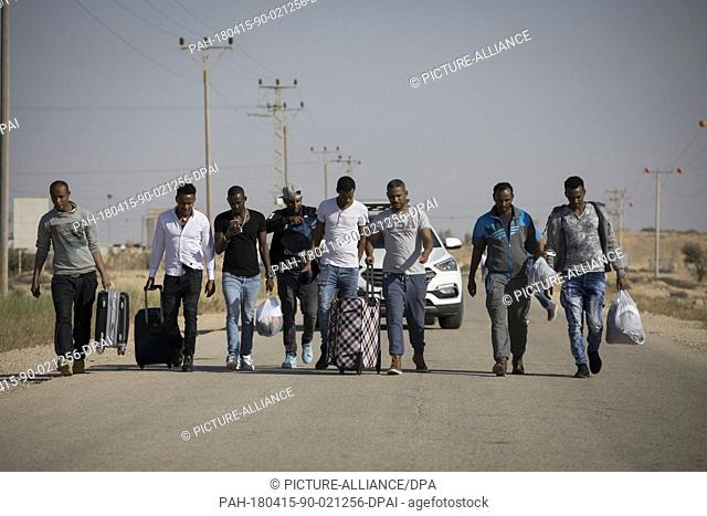 African asylum seekers, who were released earlier today, walk out of Saharonim Prison, in the Negev desert, Israel, 15 April 2018