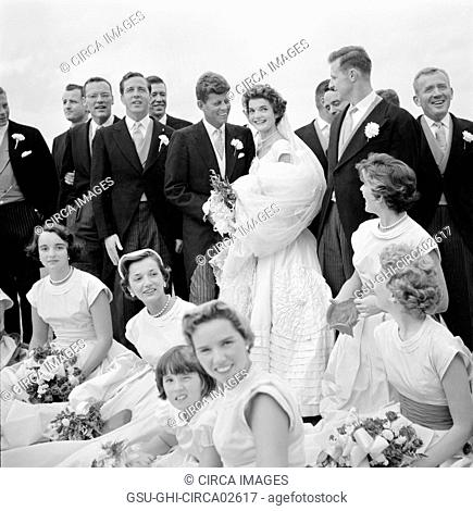 Jackie Bouvier Kennedy and John F. Kennedy, in Wedding Attire, with Members of Wedding Party, Newport, Rhode Island, USA, by Toni Frissell, September 12, 1953