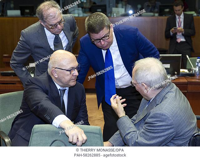 Brussels, Belgium, May 12, 2015. -- French Finance & Public Accounts Minister Michel Sapin (L) is talking with the German Finance Minister Wolfgang Schäuble...